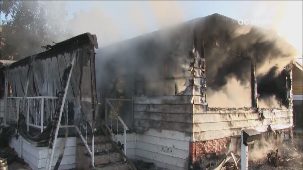 Man arrested on suspicion of arson after fire destroys Westminster mobile home; 2 injured