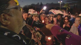 Hundreds gather at vigil to honor child found dead