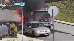 Trash truck catches fire, slams into home