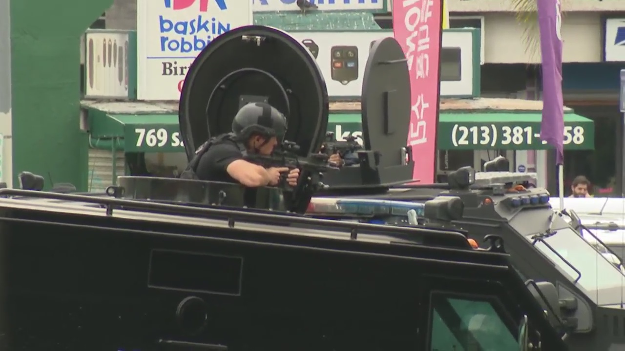 SWAT respond to armed man inside Koreatown store