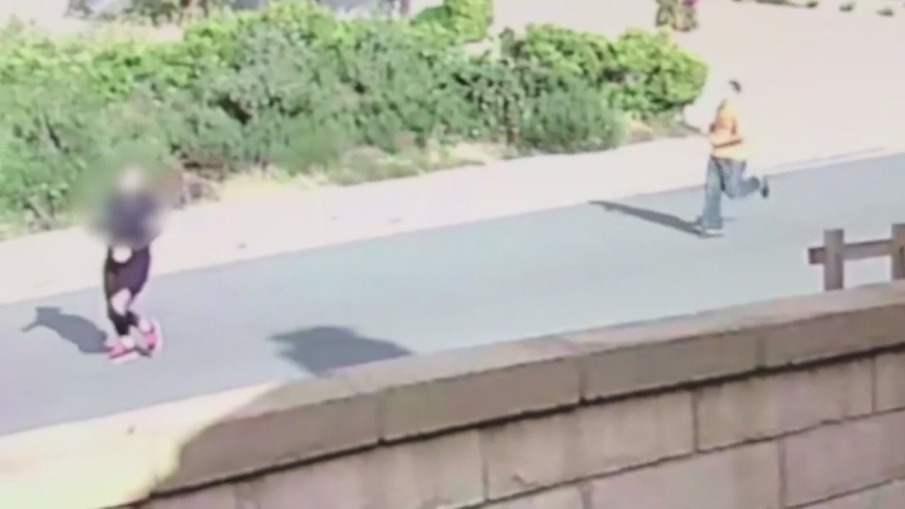 Surveillance video captures stabbing suspect running after victim