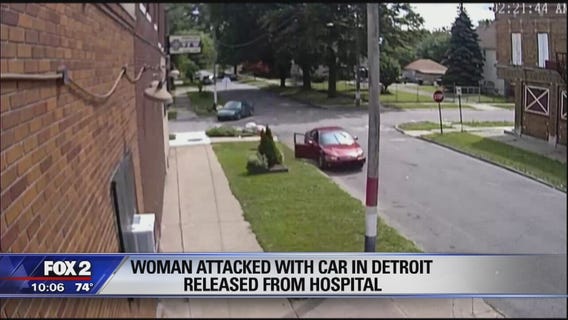 Police tow green Escort after woman intentionally hit on Detroit street