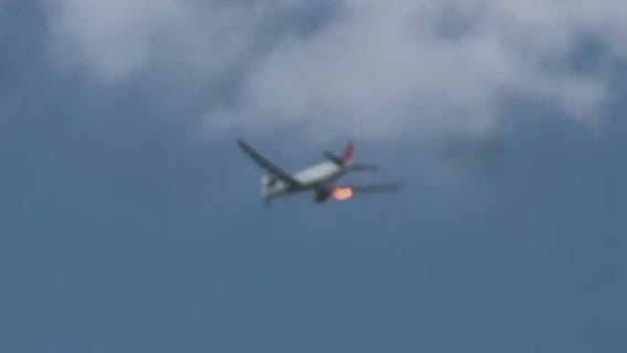 Plane departing LAX makes emergency landing after flames spew from engine