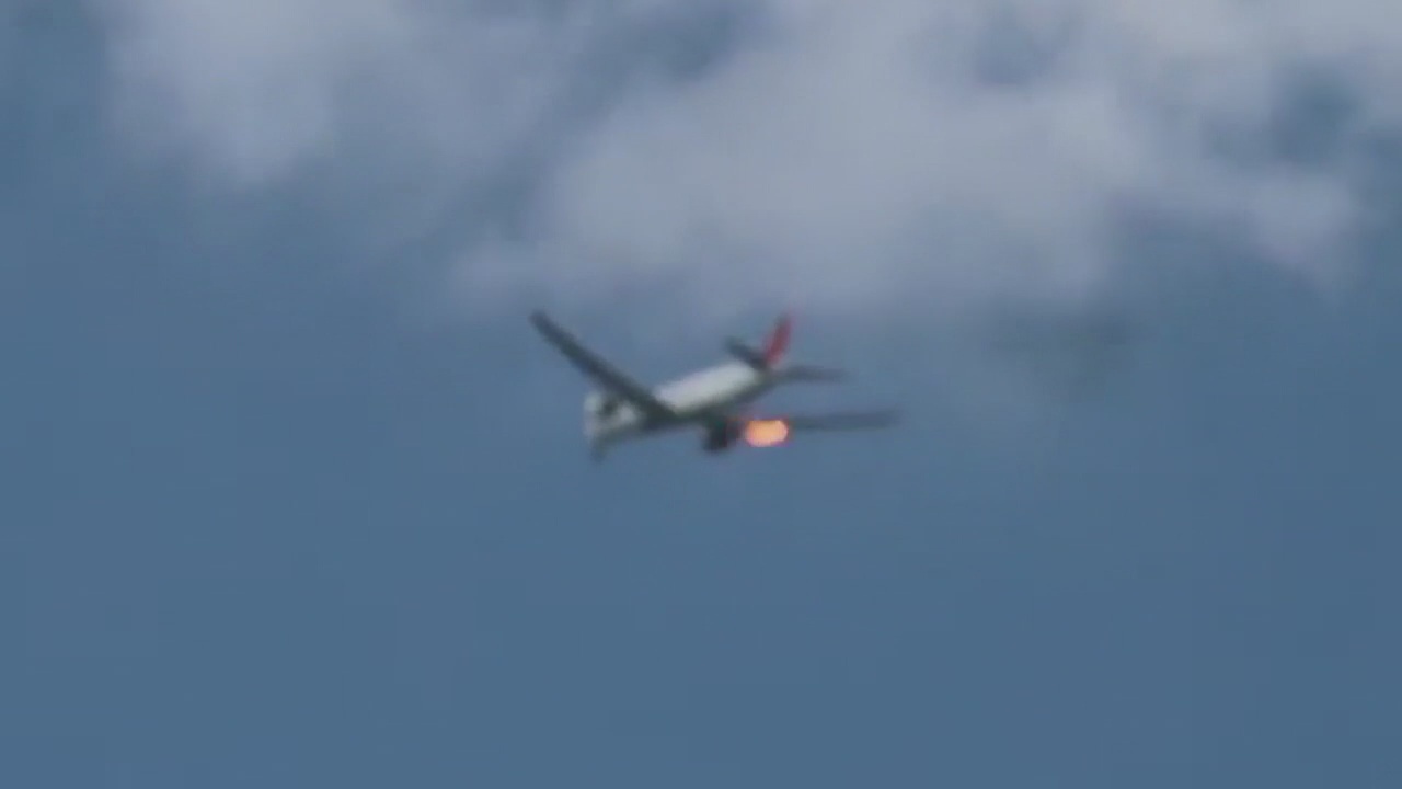 Plane departing LAX makes emergency landing after flames spew from engine