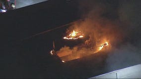 Fire crews battle blaze at vacant 5-story building in Van Nuys after roof flares up