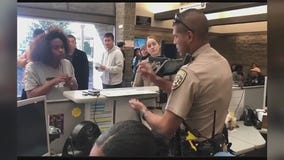 CHP officer uses sign language to help woman at DMV office