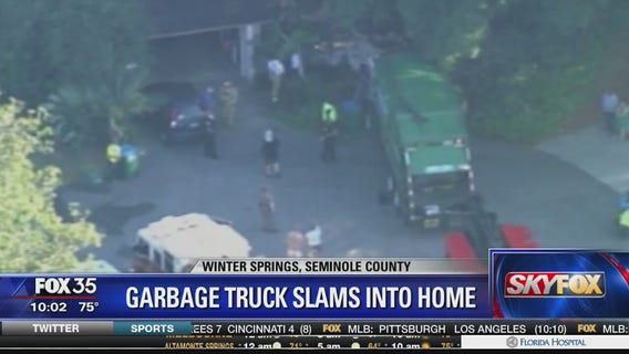 Garbage truck slams into Winter Springs home