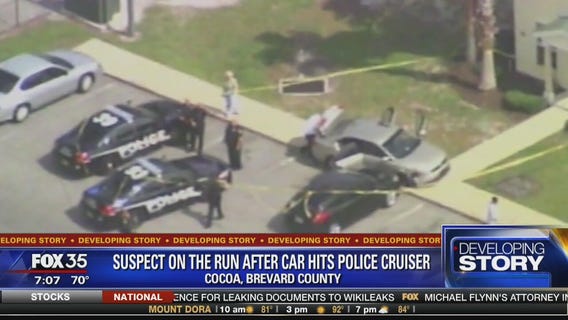 Suspect on the run after car hits police cruiser