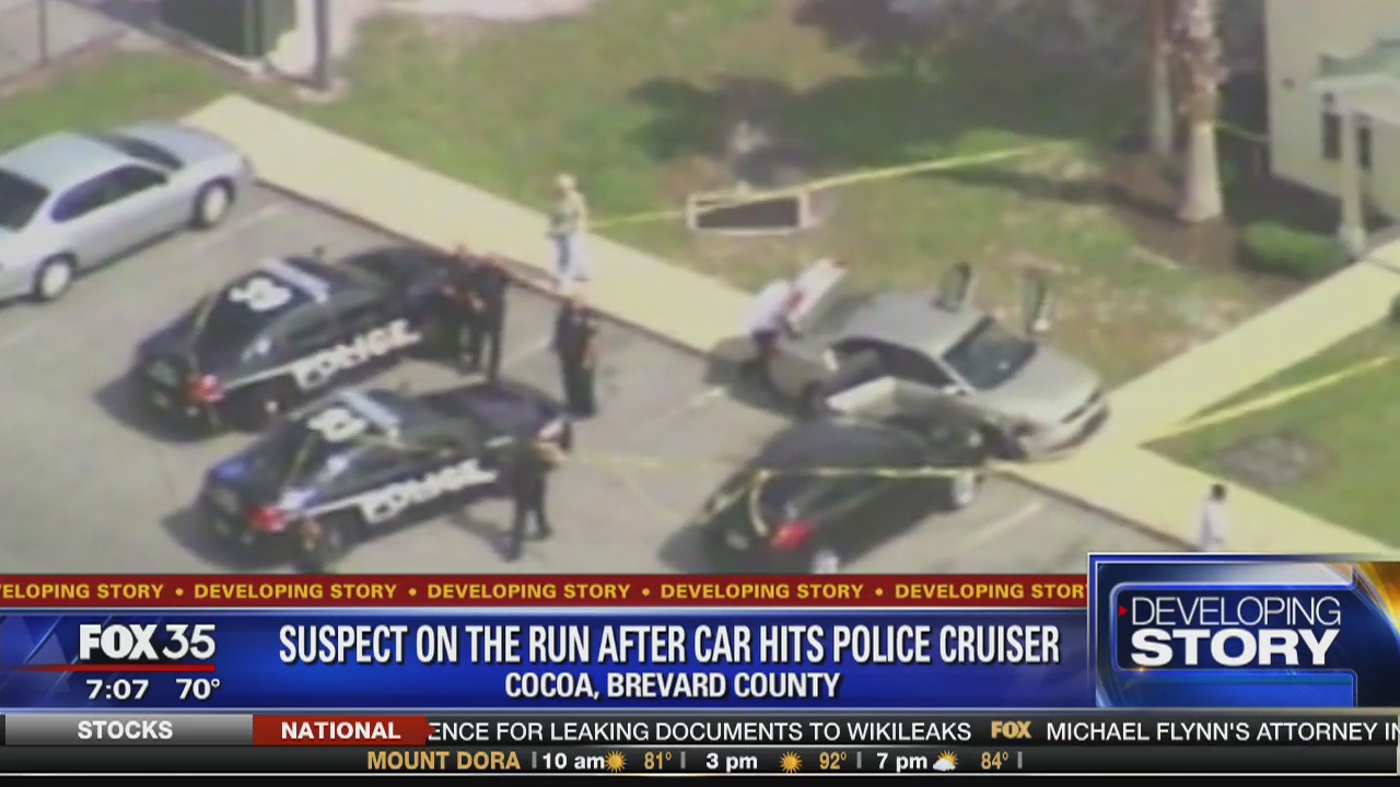 Suspect on the run after car hits police cruiser