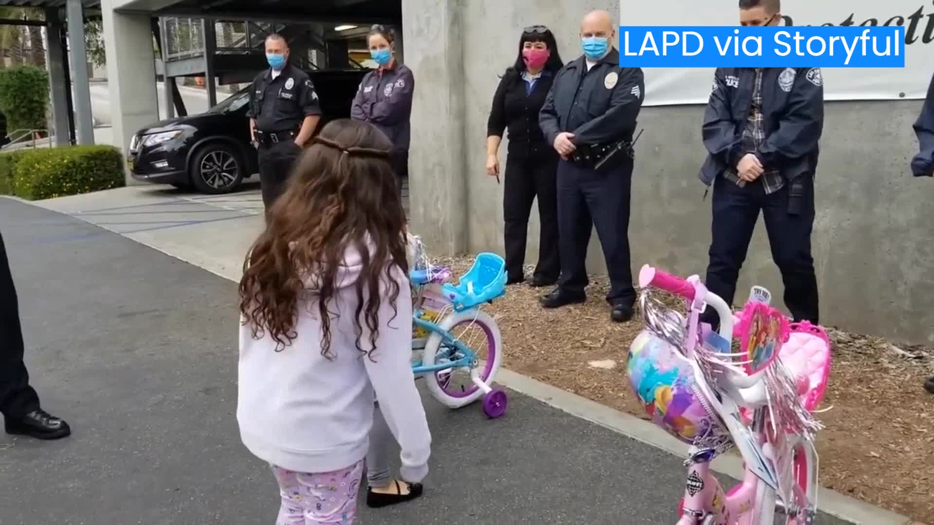 LAPD surprises sisters with bikes after theirs were stolen