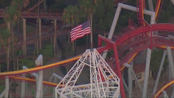 Man stands on top of tall tower at Knott's Berry Farm