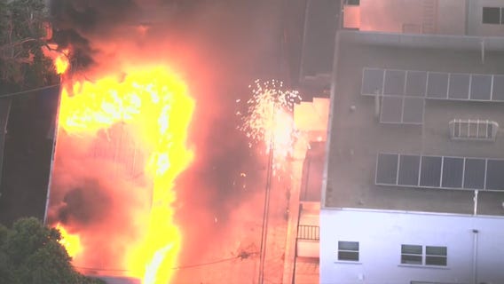 Building catches fire in Hollywood; power line sparks seen