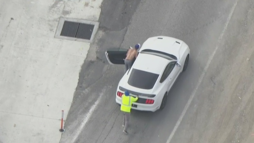 Pursuit suspect gets help pushing car off freeway after high-speed chase
