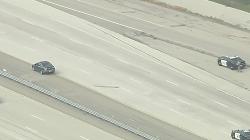 Driver apparently hits spike strip during pursuit