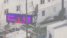 Man with sign climbs TV tower in Hollywood