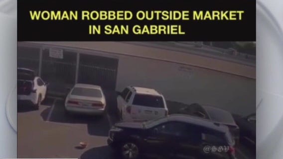 Woman dragged by SUV after being robbed