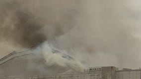 Massive fire tears through WWII-era blimp hangar