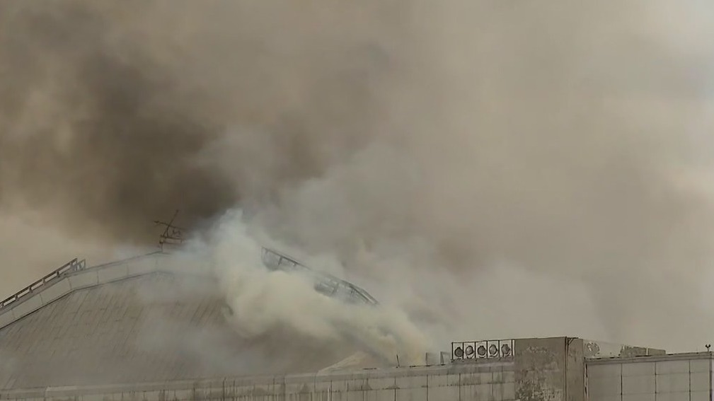 Massive fire tears through WWII-era blimp hangar
