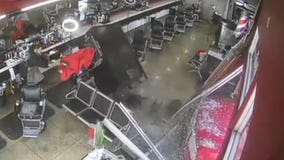 Truck smashes into barbershop