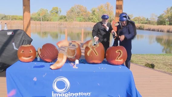 Ryan ducks behind Maurielle while making Self-Carving pumpkins