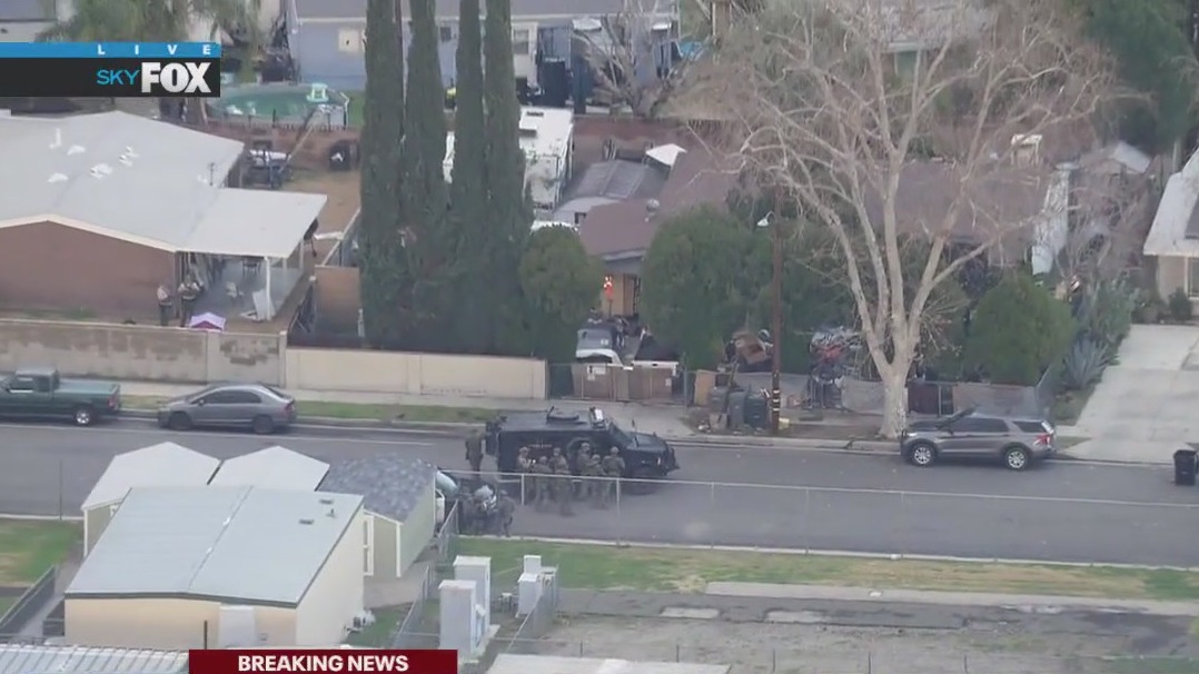 SWAT standoff with alleged machete man