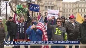 Protesters congregate outside Michigan Capitol building