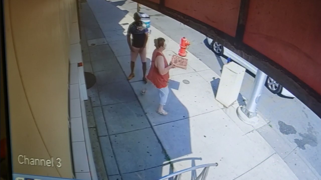 Video shows man getting coughed on by woman as he enters Detroit pizzeria