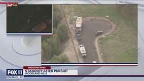 Standoff underway involving police chase suspect wanted for assault with deadly weapon