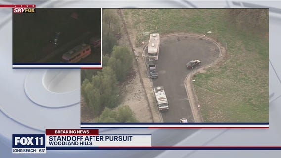 Standoff underway involving police chase suspect wanted for assault with deadly weapon