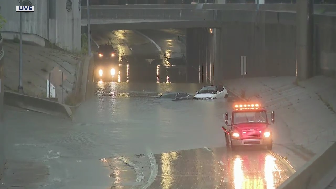 Vehicles submerged in flooded highways in downtown Detroit