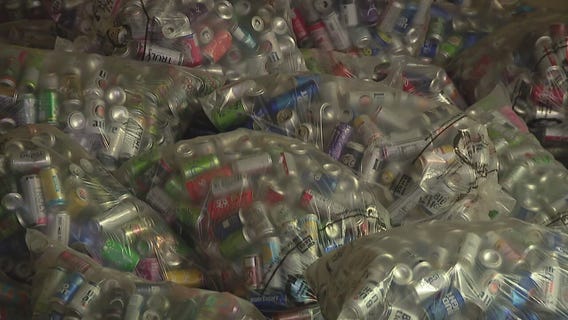Drew Clayborn and his 'crew' help sort and recycle 40,000 cans