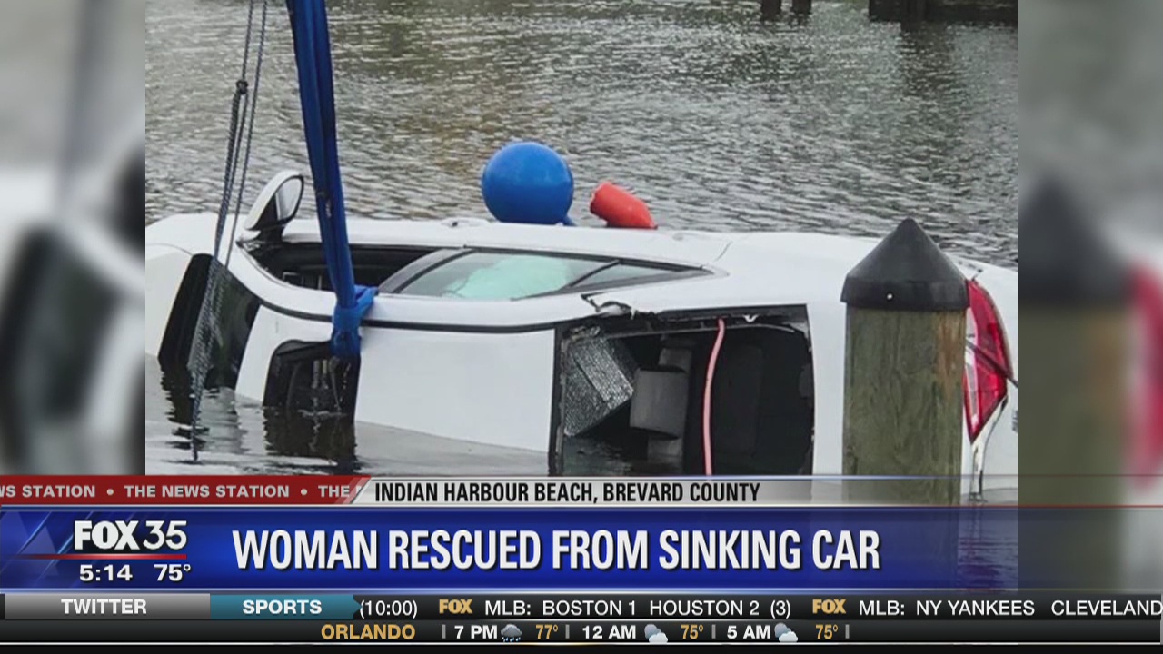 Woman rescued from sinking car