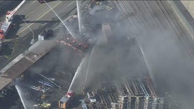 Man in custody in connection with shipping container yard fire