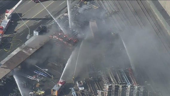 Man in custody in connection with shipping container yard fire