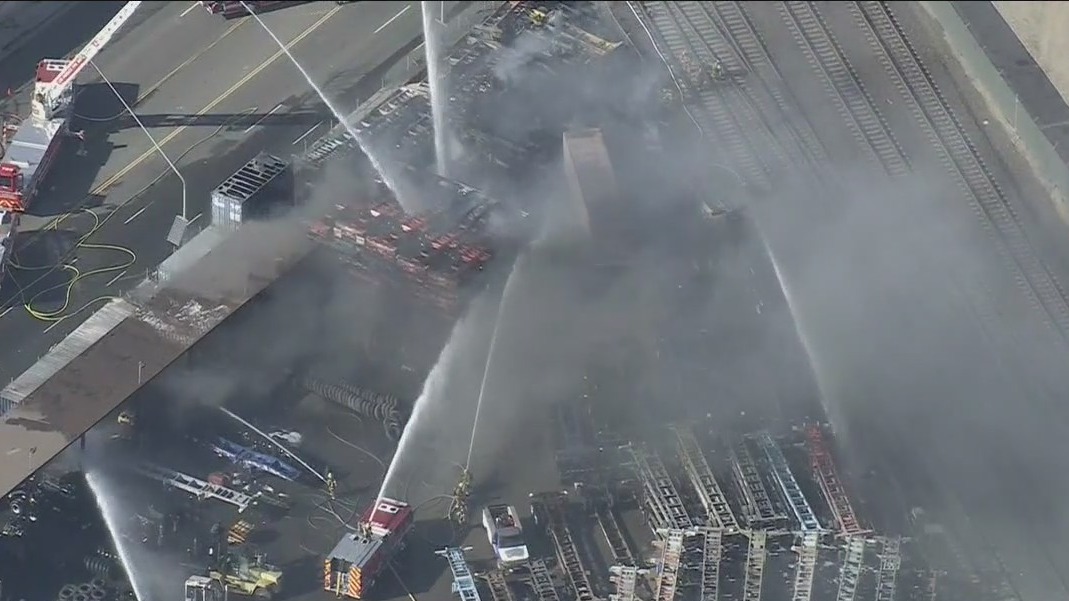 Man in custody in connection with shipping container yard fire