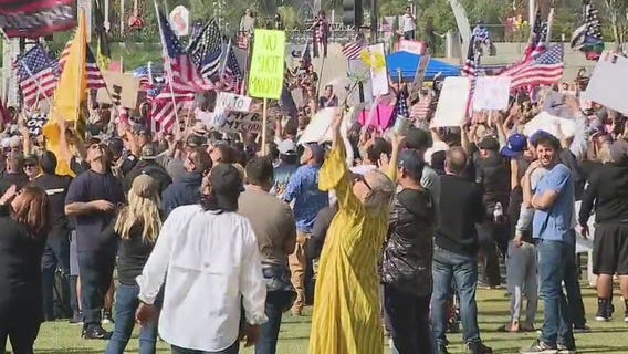 Demonstrators gather in downtown LA to protest COVID-19 vaccine mandates