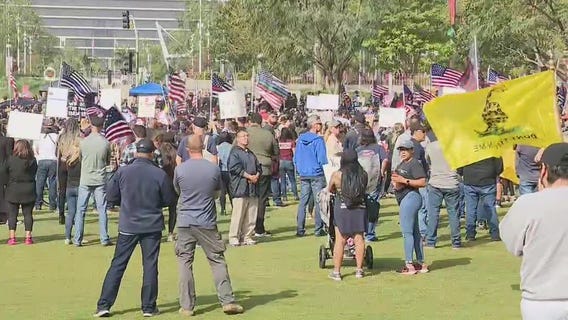 LAPD officers take part in protest while in uniform