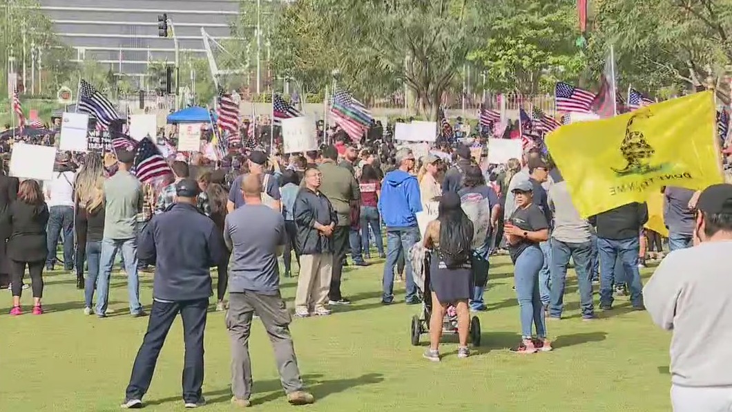 LAPD officers take part in protest while in uniform