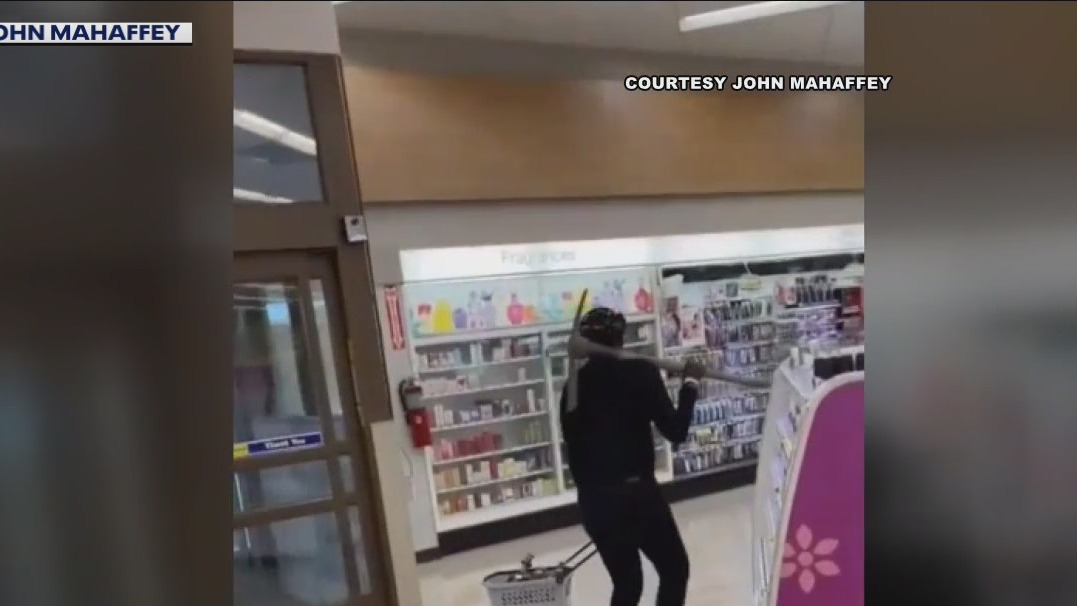 Shocking video captures woman startling shoppers in Venice with pickaxe
