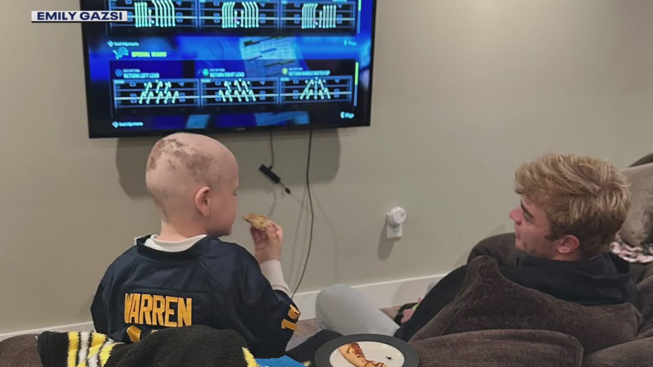 Boy waging leukemia battle forges special bond with Michigan quarterback