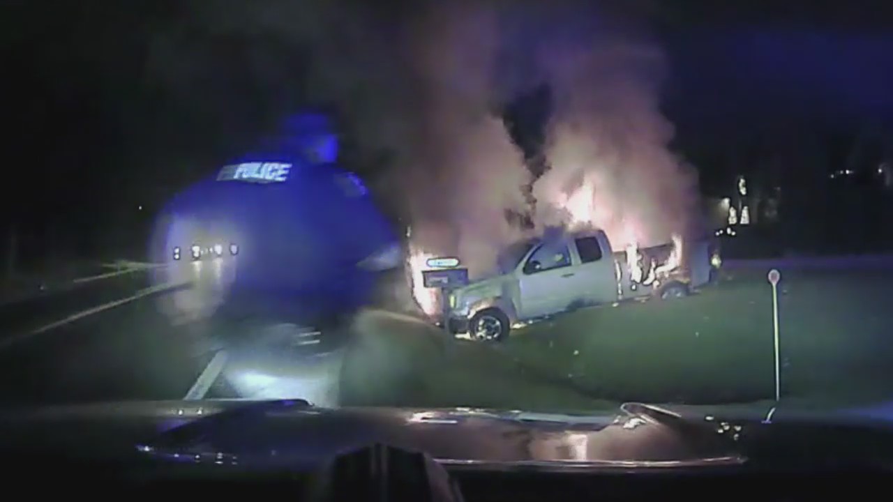 Fraser officer pulls woman from burning vehicle