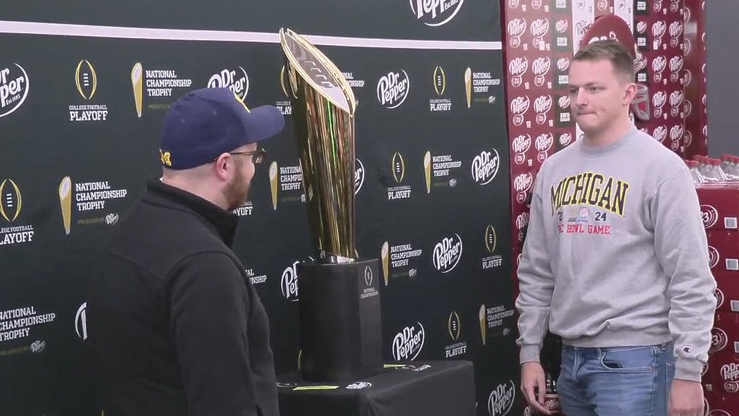 U-M football national championship trophy display attracts crowds at Meijer, Walmart