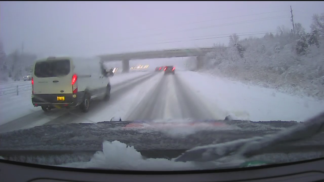 Winter weather conditions slow traffic as the snow falls in SE Michigan