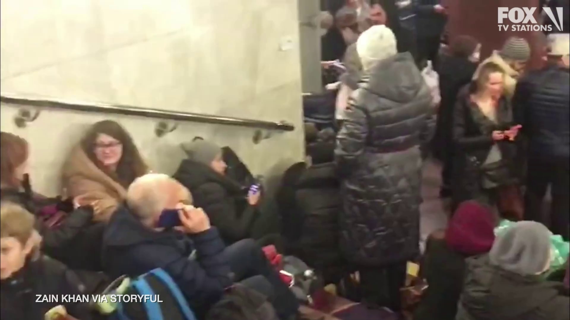 People take shelter at a subway station in Ukraine amid Russian invasion