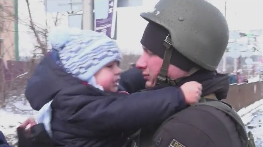 Ukrainian soldier says goodbye to child before going off to war