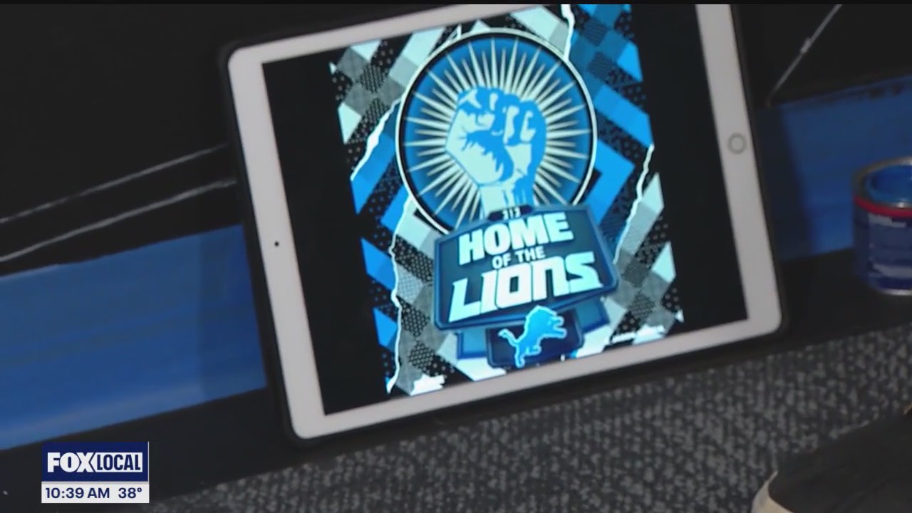 Artist Jason Garcia paints Lions mural at Fox2