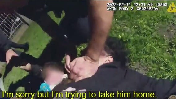 Suspect carrying baby tackled by LAPD officer