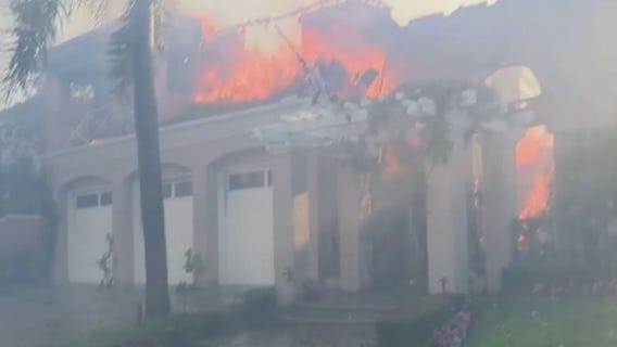 Coastal Fire: Roof collapses, loud bangs heard outside several burning OC mansions