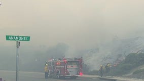 Coastal Fire: Onshore winds causing fire to spread across neighborhood