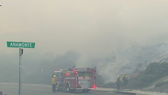 Coastal Fire: Onshore winds causing fire to spread across neighborhood